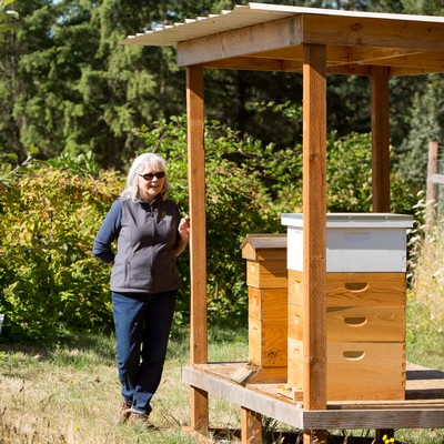 Mary Ann McNally with her bees